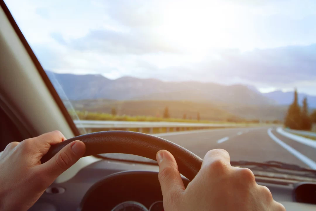 Car driving down road.