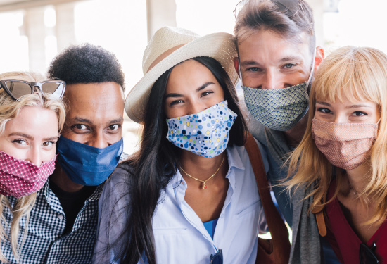diverse group of friends all wearing face masks