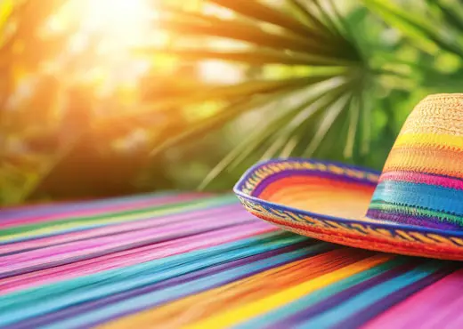 Brightly colored picnic blanket with hat