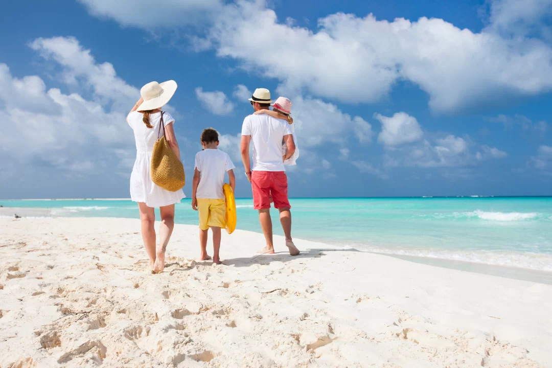 Family walking on the beach.